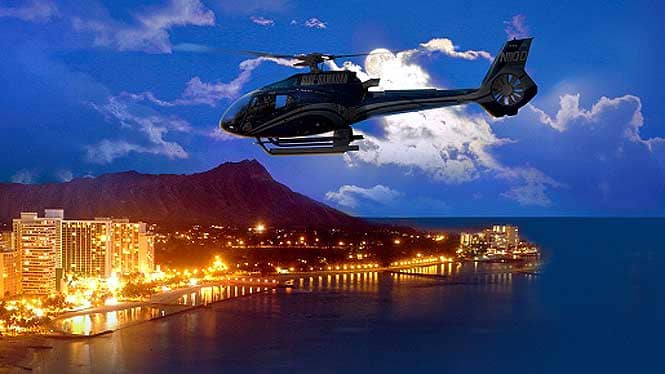 Helicopter flying over waikiki lights