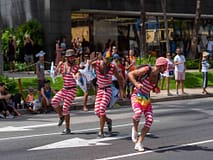 A parade in downtown waikiki always Things To Do on Oahu